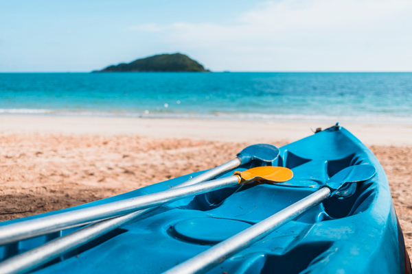 Blue kayak on the shore.